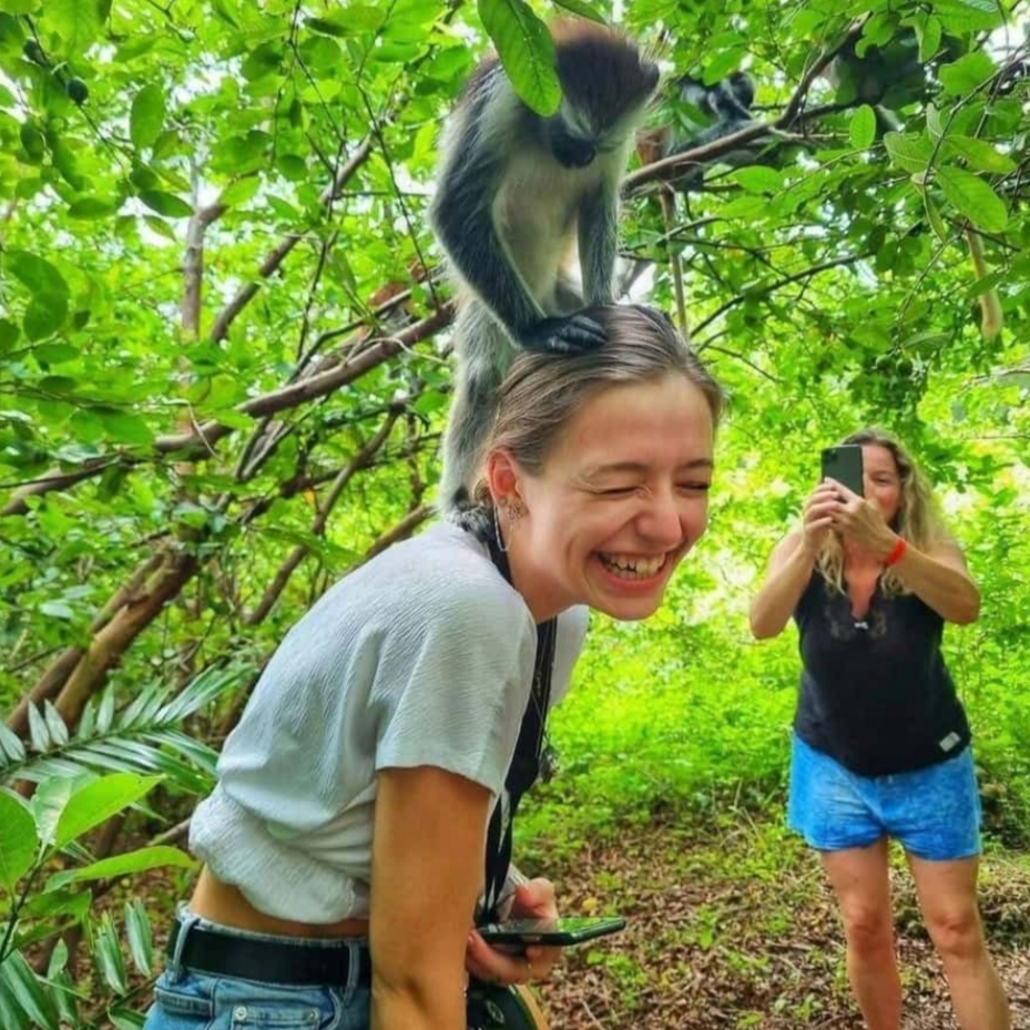 jozan play with monkey ,family-friendly activities in Zanzibar for kids